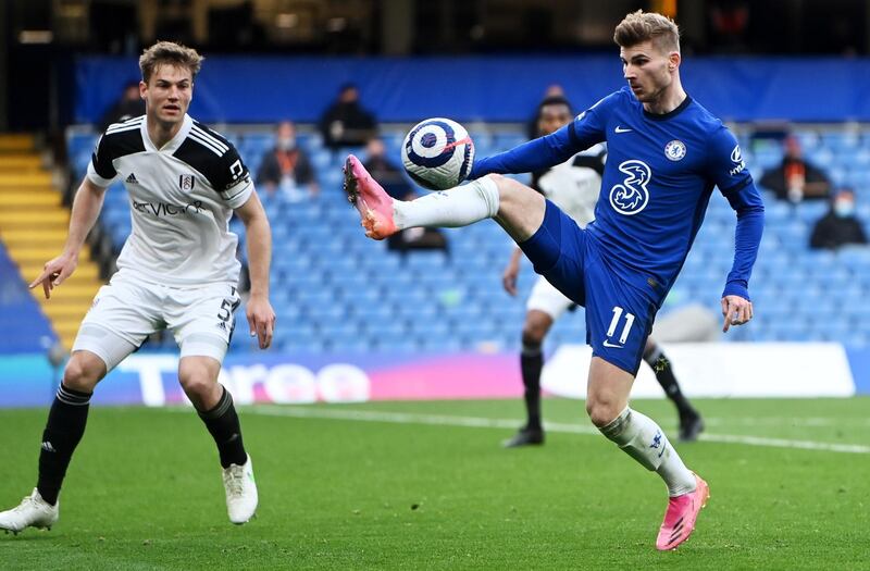 Chelsea striker Timo Werner controls the ball watched by Fulham's Joachim Andersen. EPA