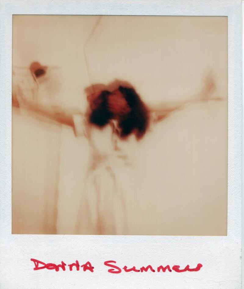 Donna Summer poses for a Polaroid portrait in 1975. Ginny Winn / Getty Images