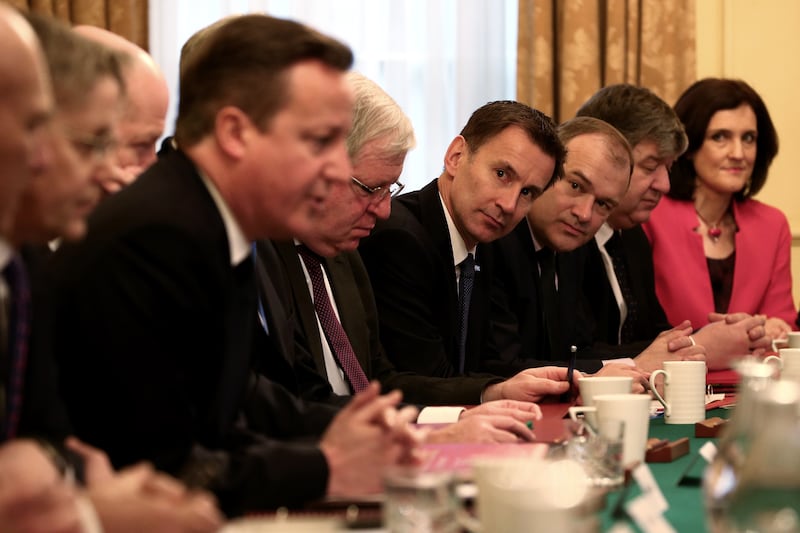 Mr Hunt looks on as then-prime minister David Cameron hosts a Cabinet meeting at No 10 Downing Street in 2015. Getty