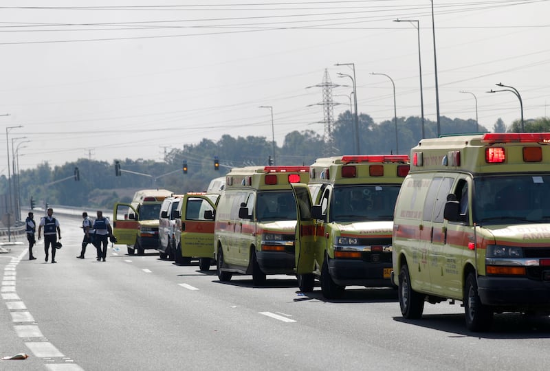 Israeli ambulances wait to evacuate wounded residents from the city of Sderot. EPA