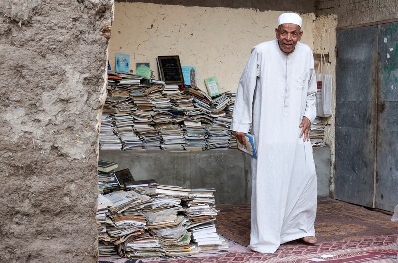 Abdallaa Abu Dawh, 82, a former teacher at Egypt's Al Azhar University who now works as an imam, reads in a library at his basement home which contains some 15,000 books he has collected. In his village in the Nile Delta, Dakahlia governorate, which is north of Cairo, he offers young men and women free books to read. 