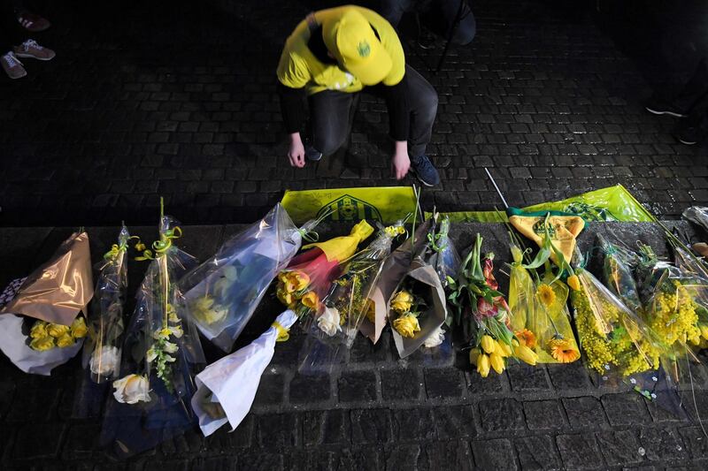 Nantes supporters lay flowers. AFP