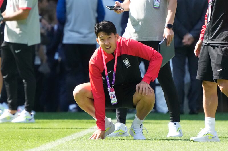 South Korea's Son Heung-min checks the pitch as he visits the Education City Stadium before their group H World Cup matches in Al Rayyan. AP
