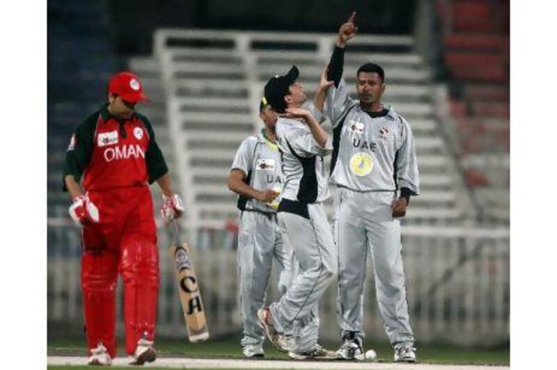 UAE’s Fahad Al Hashmi celebrates the departure of Oman’s Nadil Yousuf during the Gulf Cup Final at the Sharjah Cricket Stadium last night. The UAE eventually won on a second single over eliminator.