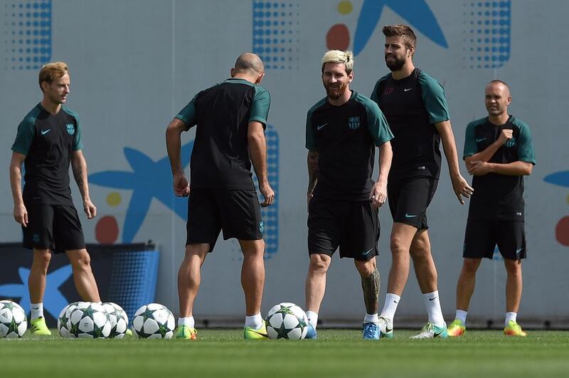 Midfielder Ivan Rakitic, defender Javier Mascherano, Messi, Pique and midfielder Andres Iniesta. Lluis Gene / AFP