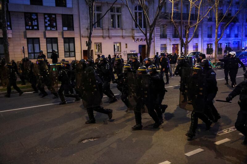 French riot officers prepare for confrontation at a Paris protest on Monday night. Reuters