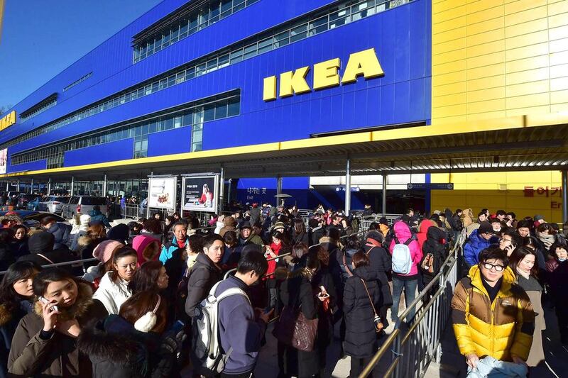 Shoppers wait in a long queue outside Ikea's in Gwangmyeong outlet in South Korea. Jung Yeon-Je / AFP