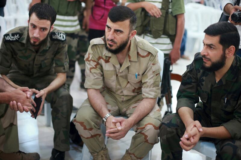 Zahran Alloush, centre, led the Jaysh Al Islam rebel group that controls the Eastern Ghouta region outside Damascus. Bassam Khabieh / Reuters / August 27, 2014