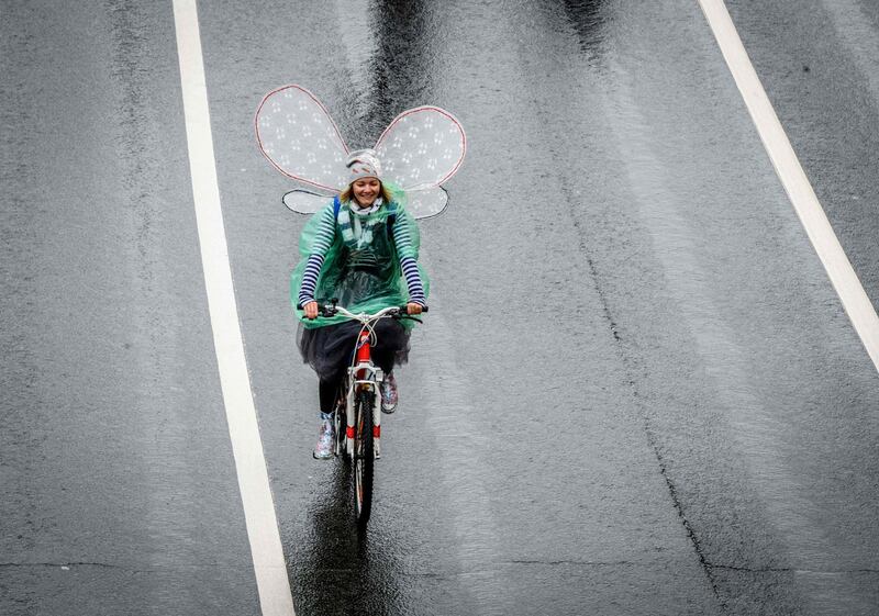 A participant in the Moscow bicycle parade rides on a street in central Moscow. Mladen Antonov / AFP