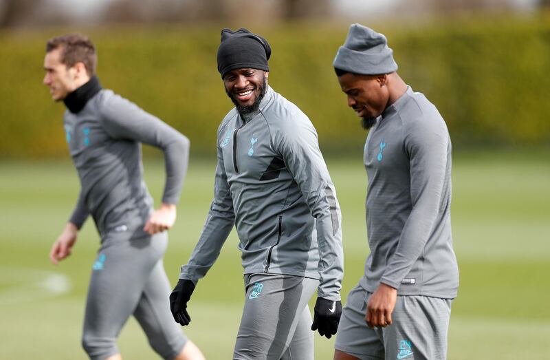 Tottenham Hotspur's Tanguy Ndombele, centre, with Serge Aurier during training ahead of the Champions League last-16 second leg against RB Leipzig. Reuters