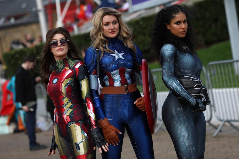 Cosplayers dressed as female versions of Marvel superheroes Iron Man, Captain America and the Silver Surfer. AFP