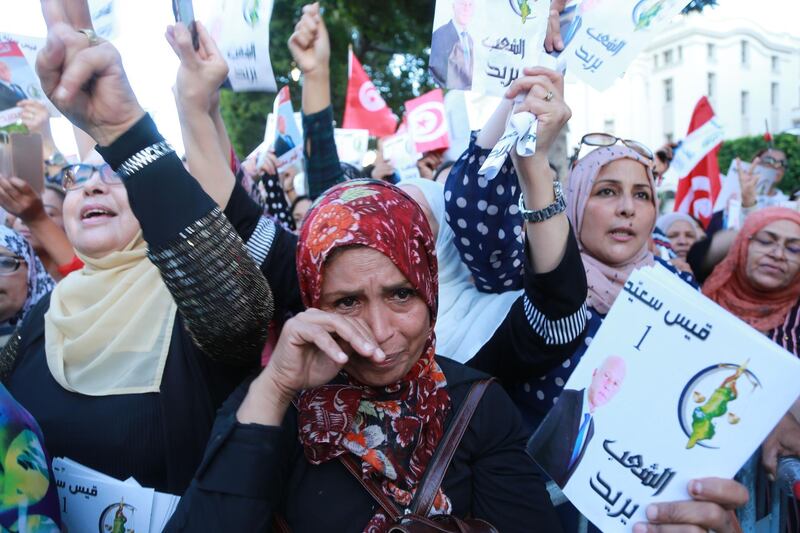 Supporters of Tunisian presidential candidate Kais Saied campaign in Tunis. AFP