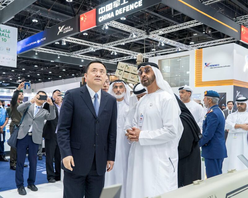 ABU DHABI, UNITED ARAB EMIRATES - February 20, 2019: HH Sheikh Mohamed bin Zayed Al Nahyan, Crown Prince of Abu Dhabi and Deputy Supreme Commander of the UAE Armed Forces (front R) visits Hanwha stand, during the 2019 International Defence Exhibition and Conference (IDEX), at Abu Dhabi National Exhibition Centre (ADNEC). Seen with HE Major General (Ret) Khaled Abdullah Al Bu Ainain, President of the Institute for Near East and Gulf Military Analysis (INEGMA) (back C).

( Rashed Al Mansoori / Ministry of Presidential Affairs )
---