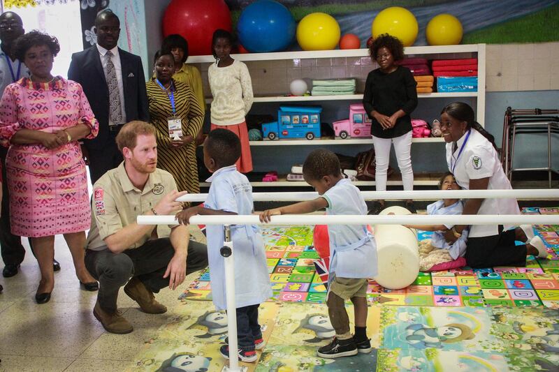 Prince Harry meets with the centre's young patients. EPA