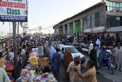 Afghan refugees throng the Board Bazaar marketplace in Peshawar.