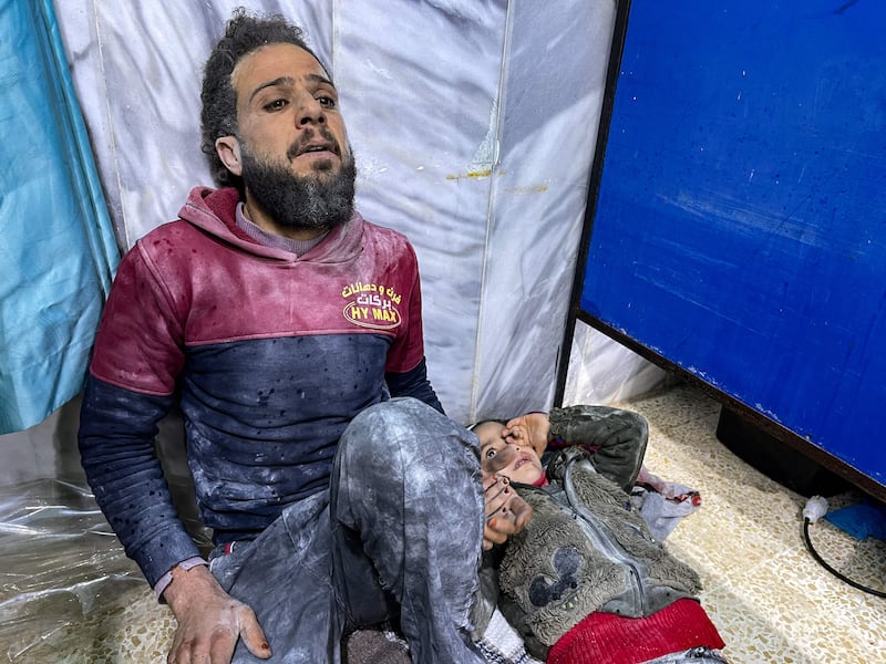 An injured man waits for treatment at Bab Al Hawa hospital in Syria's Idlib province. AFP