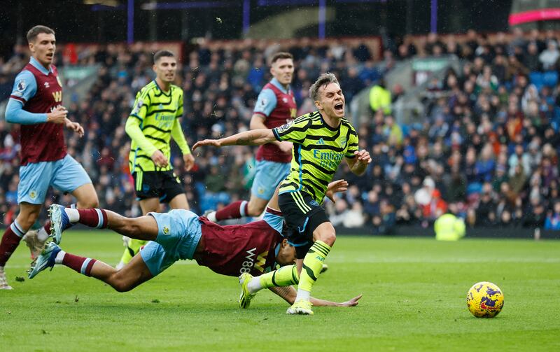 Arsenal's Leandro Trossard is fouled by Burnley's Lorenz Assignon resulting in a penalty. AP