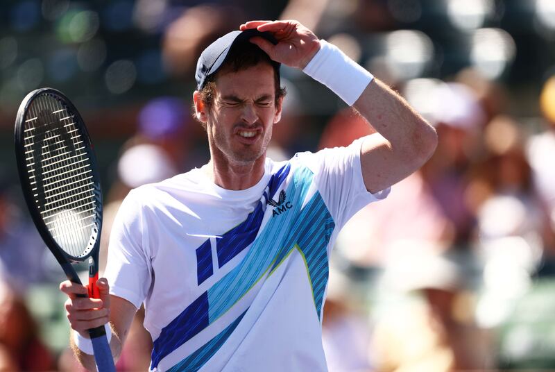 Andy Murray of Great Britain shows his emotion on his way to his 700th tour victory against Taro Daniel of Japan. AFP
