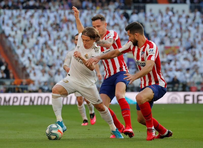 Real Madrid's Luka Modric battles for the ball on Saturday. Reuters