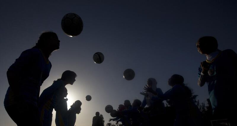 Palestinian girls take part in a training session at the Beit Lahia football club in northern Gaza strip. Mahmud Hams / AFP