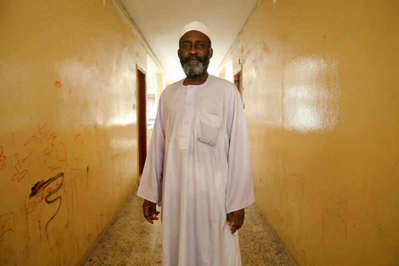Dubai, UAE, July 8, 2012:
Ahmed Omar, a native of Sudan, has been living inside of the Sheikh Rashid Colony (also known as the 7,000 building because of its original rental price) for 11 and a half years. He doesn't know where he and his family will go yet. He is seen here in the hallway leading to his flat.

The residents of the area were told on June 1st via text message that they would have to vacate their homes by mid july at the very latest. 

Lee Hoagland/The National