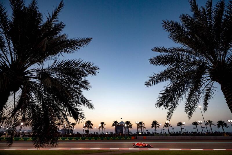 Ferrari's Finnish driver Kimi Raikkonen steers his car at sunset. AFP