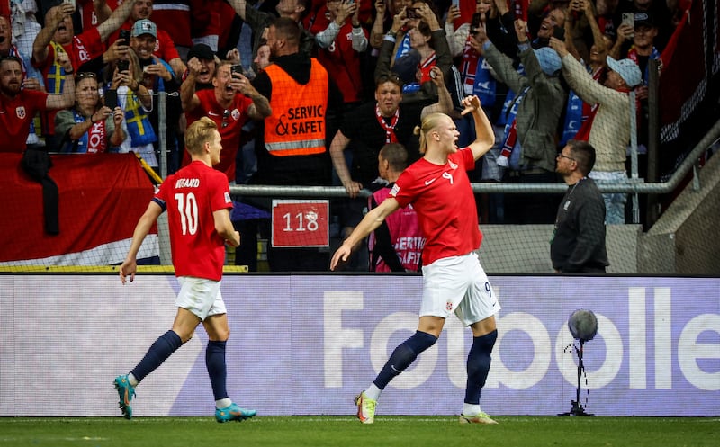 Soccer Football - UEFA Nations League - Group H - Sweden v Norway - Friends Arena, Solna, Sweden - June 5, 2022 Norway's Erling Braut Haaland celebrates scoring their first goal with Martin Odegaard  Christine Olsson/TT News Agency via REUTERS     ATTENTION EDITORS - THIS IMAGE WAS PROVIDED BY A THIRD PARTY.  SWEDEN OUT.  NO COMMERCIAL OR EDITORIAL SALES IN SWEDEN. 