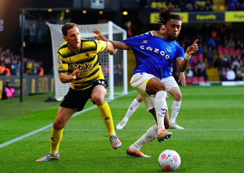Watford's Dan Gosling and Everton's Alex Iwobi battle for the ball. PA