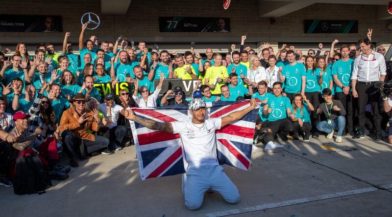 Lewis Hamilton celebrates after clinching the title last season. AFP