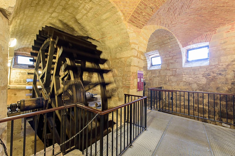 The Pilsen medieval network of vaulted subterranean tunnels stretches for more than 12 miles and contains replicas of former features, such as this water wheel. Alamy