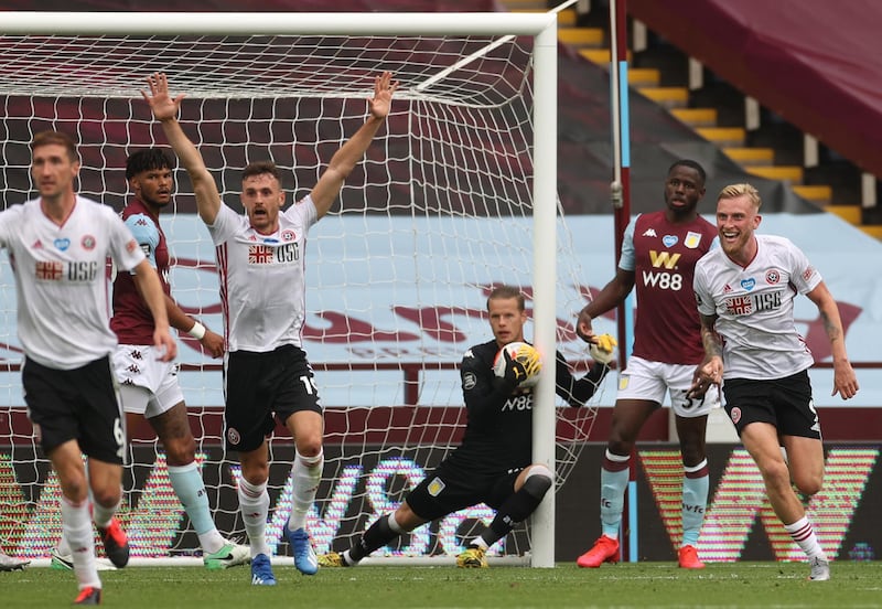 Oliver McBurnie and Jack Robinson of Sheffield United appeal for a goal which is later denied as Orjan Nyland of Aston Villa catches the ball at Villa Park on Wednesday. Getty