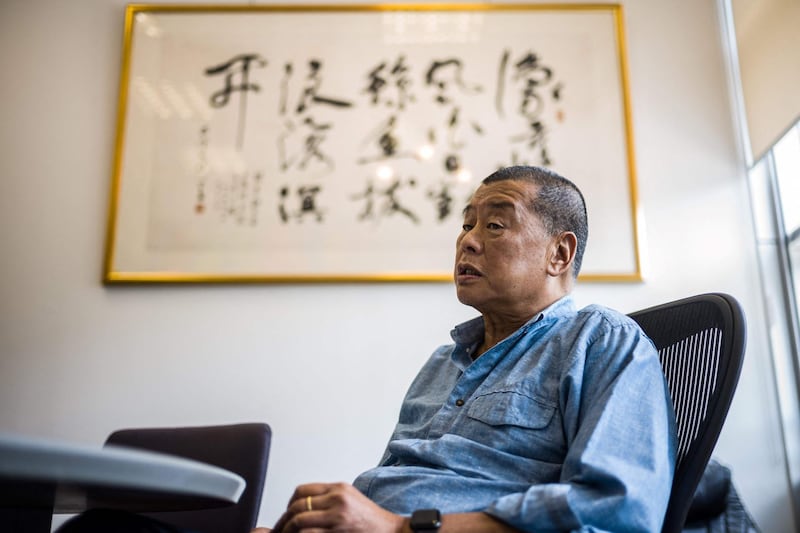 (FILES) In this file photo taken on June 16, 2020, millionaire media tycoon Jimmy Lai, 72, speaks during an interview with AFP at the Next Digital offices in Hong Kong.  Lai was jailed for 12 months on April 16, 2021 over one of the city's biggest ever protests in 2019. / AFP / Anthony WALLACE
