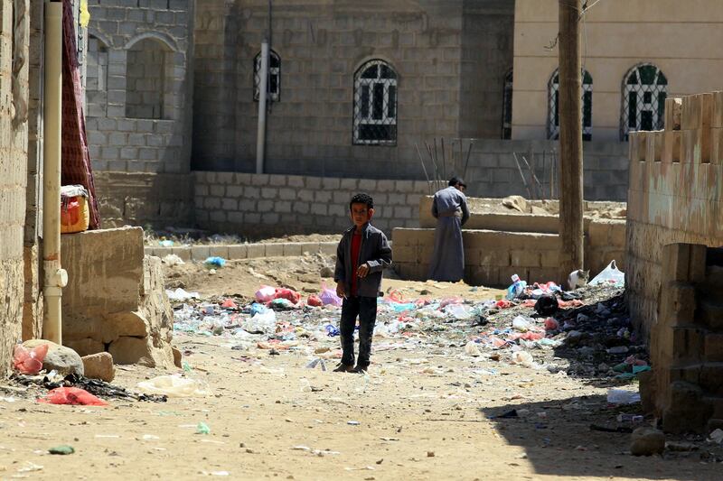 epa07089184 A Yemeni child walks past rubbish on a street amid a cholera outbreak in Sanaâ€™a, Yemen, 12 October 2018. According to reports, at least 200 associated deaths and nearly 155,000 suspected cholera cases were reported in Yemen between January and the end of August 2018 due to lack of access to clean water and a shortage of medical supplies.  EPA/YAHYA ARHAB