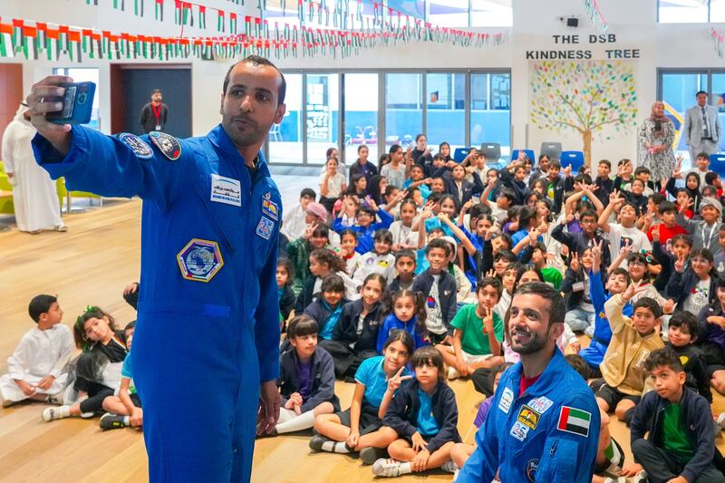 Minister of State for Youth Dr Sultan Al Neyadi, right, and fellow Emirati astronaut Maj Hazza Al Mansoori meet school pupils to talk about their missions in space. All photos: @Astro_Alneyadi / X