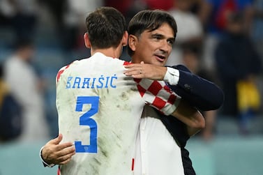 Croatia's coach #00 Zlatko Dalic celebrates with Croatia's defender #03 Borna Barisic after winning the Qatar 2022 World Cup round of 16 football match between Japan and Croatia at the Al-Janoub Stadium in Al-Wakrah, south of Doha on December 5, 2022.  (Photo by Ina Fassbender  /  AFP)