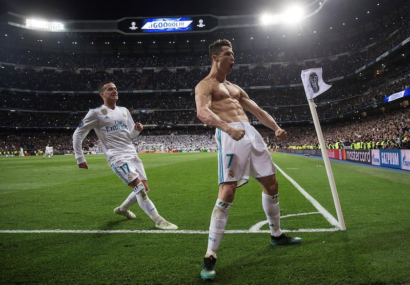 epaselect epa06662446 Real Madrid's Cristiano Ronaldo (R) celebrates next to Lucas Vazquez (L) after scoring the 1-3 during the UEFA Champions League quarter final, second leg soccer match between Real Madrid and Juventus at Santiago Bernabeu stadium in Madrid, Spain, 11 April 2018.  EPA/RODRIGO JIMENEZ