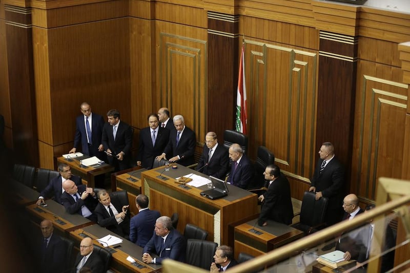 Lebanese president Michel Aoun, centre, sits in parliament with speaker Nabih Berri to his right on October 31, 2016. Joseph Eid / AFP