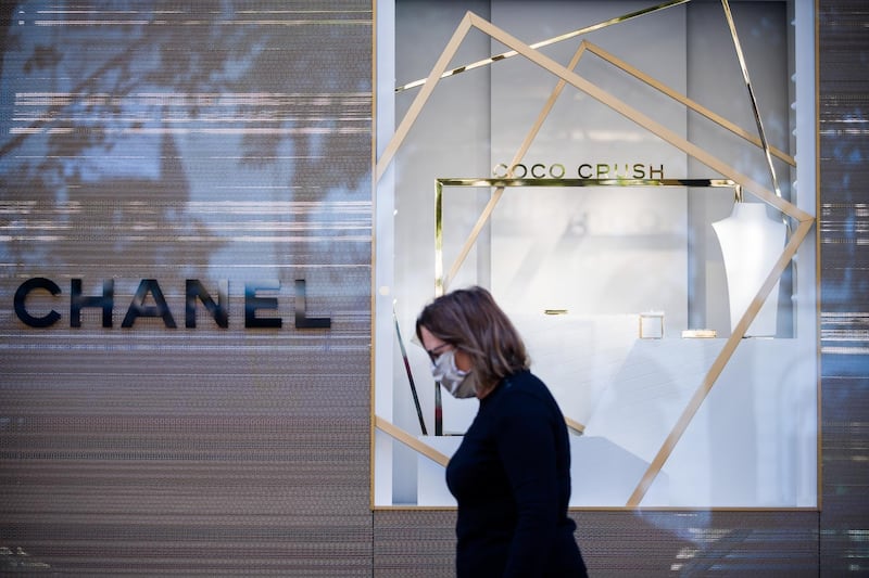 A pedestrian passes the Chanel SA flagship luxury goods store on Avenue Montaigne in Paris, France, on Wednesday, Aug. 12, 2020. As the capital of the world’s No. 1 tourist destination, Paris has no shortage of hotels for all tastes and wallets, from the dumpy dive to the pillared palace, where a single night can set you back as much as 30,000 euros ($35,000). Photographer: Nathan Laine/Bloomberg