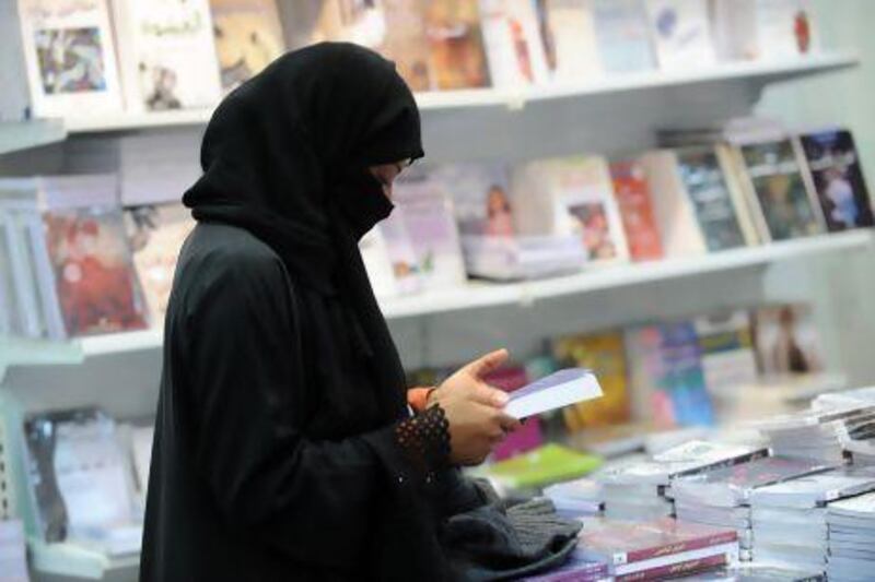 A Saudi woman attends the annual International Book Exhibition in Riyadh. The push and pull over women’s rights illustrates the process of reform in the kingdom.