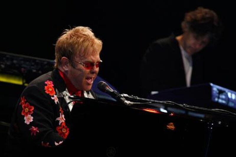 Elton John and his band perform at the Emirates Palace hotel in Abu Dhabi in 2008. Joseph J Capellan / The National