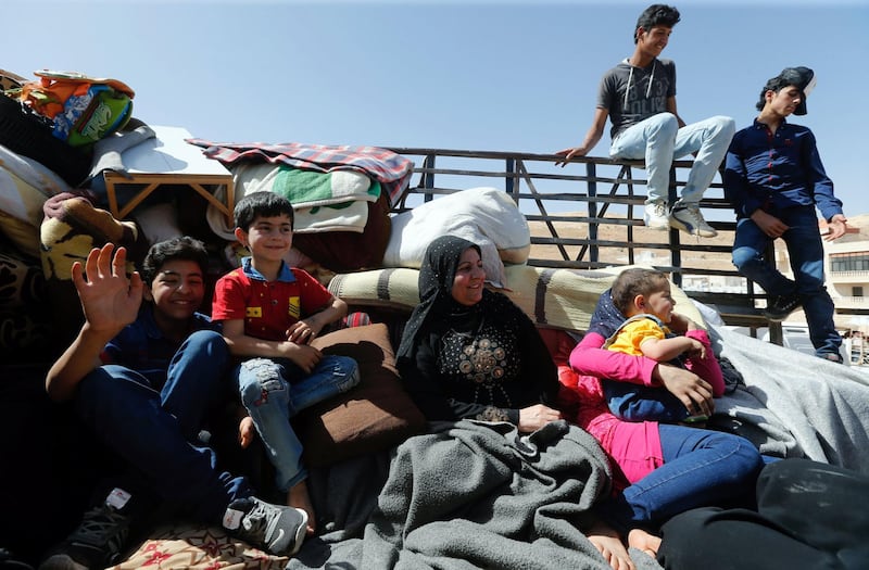 Syrian refugees prepare to return to Syria from the Lebanese border town of Arsal, Lebanon, on June 28, 2018. Mohamed Azakir / Reuters