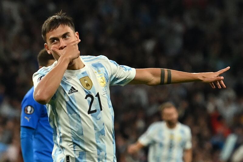 Argentina's striker Paulo Dybala celebrates after scoring their third goal during the 'Finalissima' International friendly football match between Italy and Argentina at Wembley Stadium in London on June 1, 2022.  - The Azzurri face the South American continental champions in the inaugural Finalissima at Wembley.  (Photo by Glyn KIRK  /  AFP)