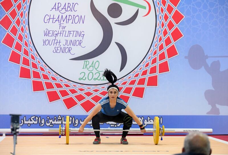 An Iraqi Kurdish woman competes during a weightlifting championship in Arbil, in which 14 Arab countries, including Egypt and Saudi Arabia, participated.