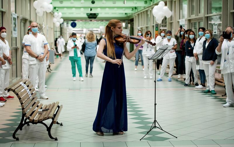 Italian violinist Fiamma Flavia Paolucci performs at Tor Vergata Hospital in Rome.  AFP