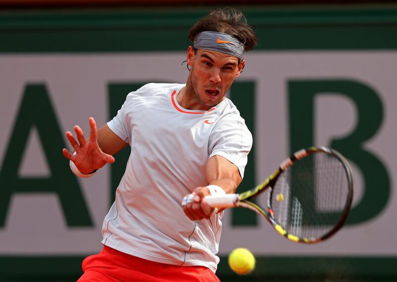 PARIS, FRANCE - JUNE 03:  Rafael Nadal of Spain plays a forehand in his Men's Singles match against Kei Nishikori of Japan during day nine of the French Open at Roland Garros on June 3, 2013 in Paris, France.  (Photo by Julian Finney/Getty Images) *** Local Caption ***  169854118.jpg