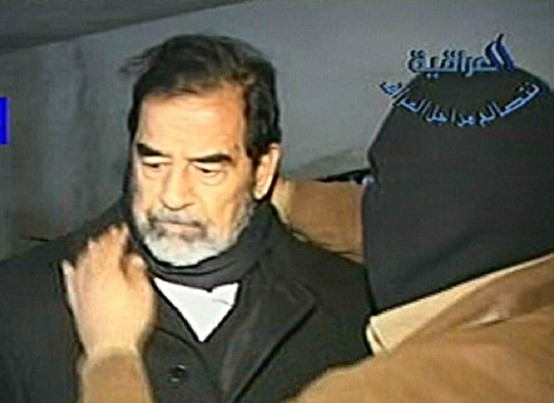 A video grab shows ousted Iraq president Saddam Hussein moments before being hanged in Baghdad in December 2006. Iraqi state television showed a brief film of Saddam being placed in a noose by masked hangmen, cutting away just before his execution.  AFP