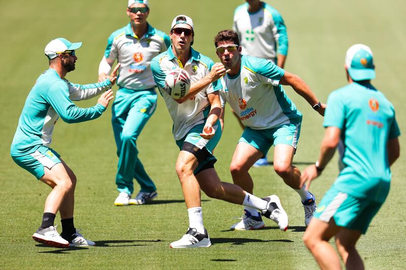 Pat Cummins of Australia plays rugby during an Australian nets session at the Adelaide Oval. Getty