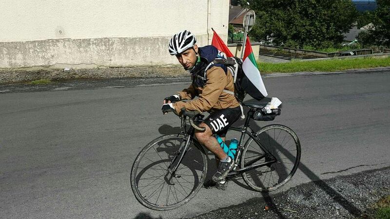 Cyclist Rashed Al Yafai is flying the flag not just for the UAE but also for Islam as he tours Europe on his bike. Courtesy Rashed Al Yafai