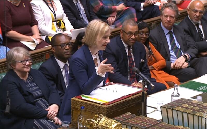UK Prime Minister Liz Truss speaks in Parliament, as Foreign Secretary James Cleverly, to the right of her, looks on. AFP