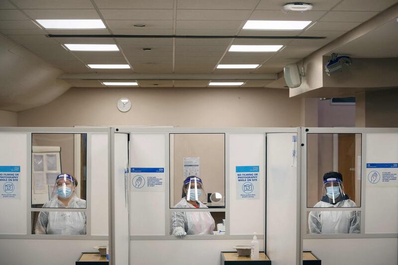 Health workers prepare to assist at an NHS Covid-19 testing unit at the Civic Centre in Uxbridge, Hillingdon, west London. AFP
